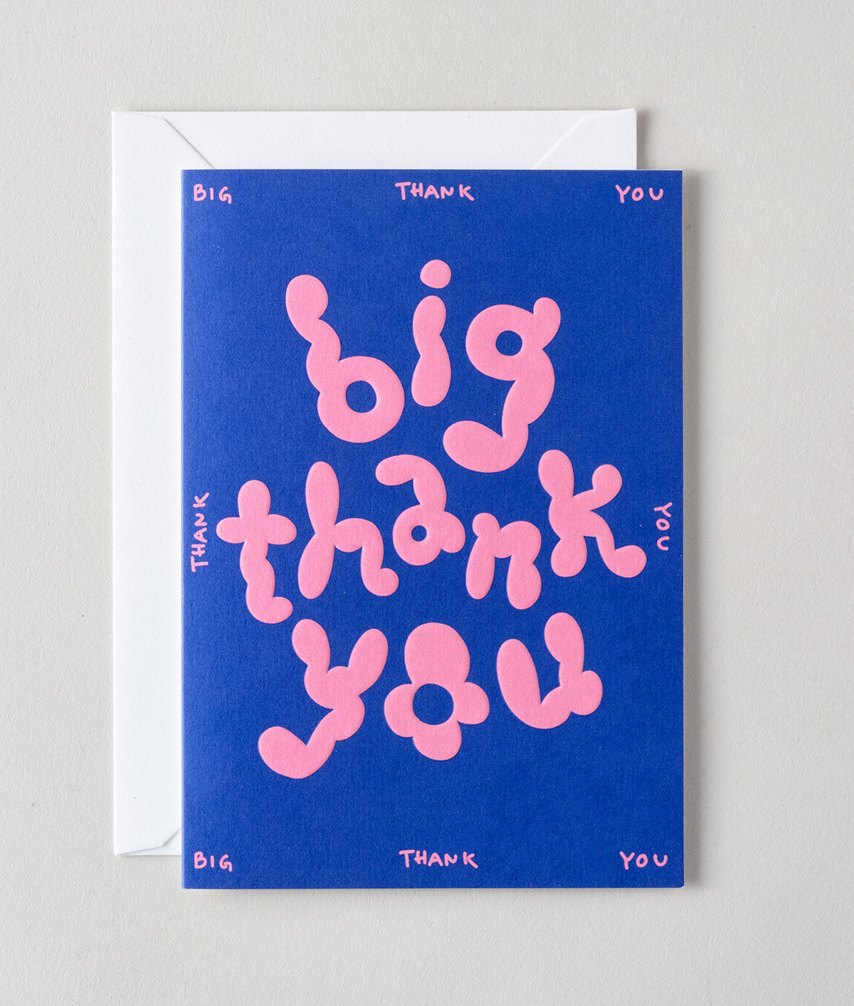a colourful thank you card that is pink bubble writing saying big thank you on a pink background