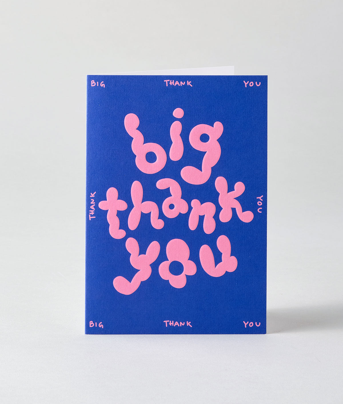 a colourful thank you card that is pink bubble writing saying big thank you on a pink background