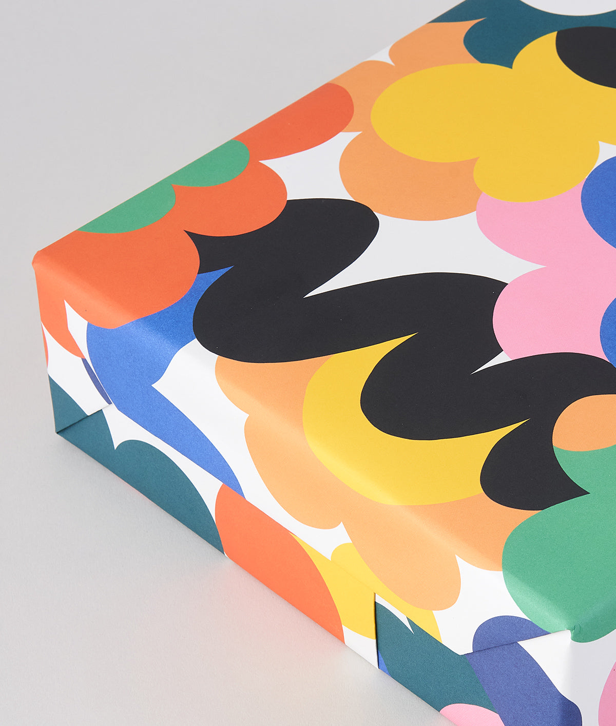 close up detail of Abstract floral mutli coloured Micke Lindebergh wrapping paper wrapped present
