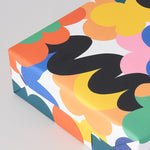close up detail of Abstract floral mutli coloured Micke Lindebergh wrapping paper wrapped present