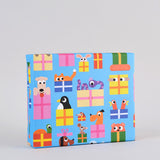 Image is a present wrapped in wrapping paper covered infun cartoon animals peeping out of presents on a blue background