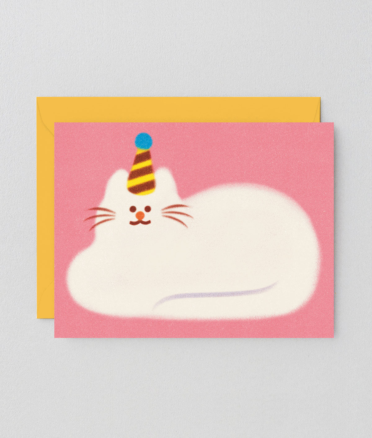 pink greetings card showing an illustration of a fluffy white cat lying down wearing a party hat