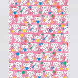 full view of polka dot monkeys celebrating with hats and streamers cover this pink celebration birthday wrapping paper