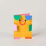 gif animation of yellow die cut bear kids birthday card with green and blue arms, and red and pink feet