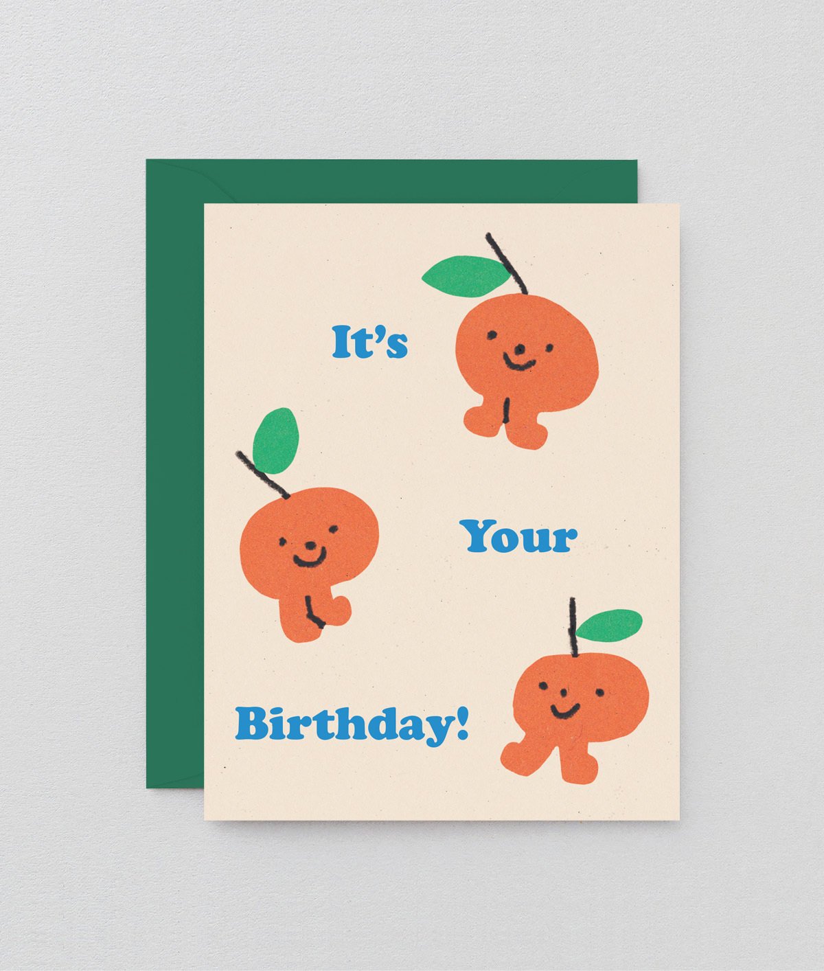 three sweet little oranges celebrating a birthday on a cream background with blue writing that reads it's your birthday!
