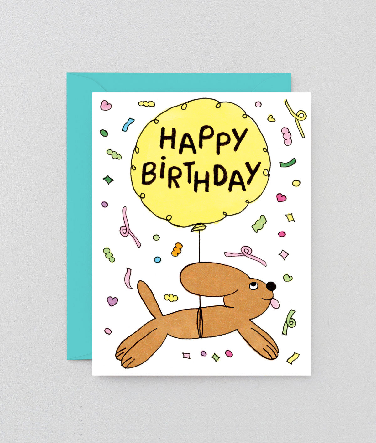 Birthday card with a dog and balloon on a gray background