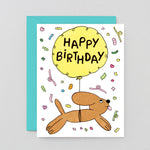 Birthday card with a dog and balloon on a gray background