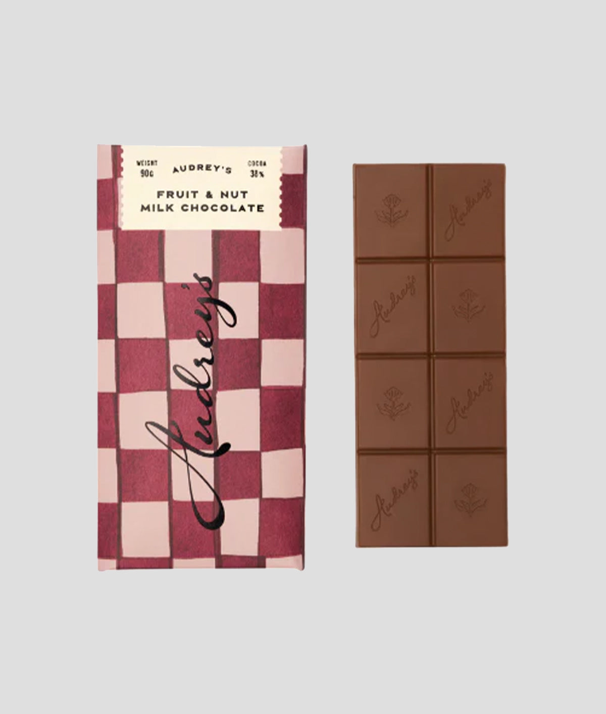 Audrey's Fruit & Nut Milk Chocolate bar with checkered packaging on a light grey background
