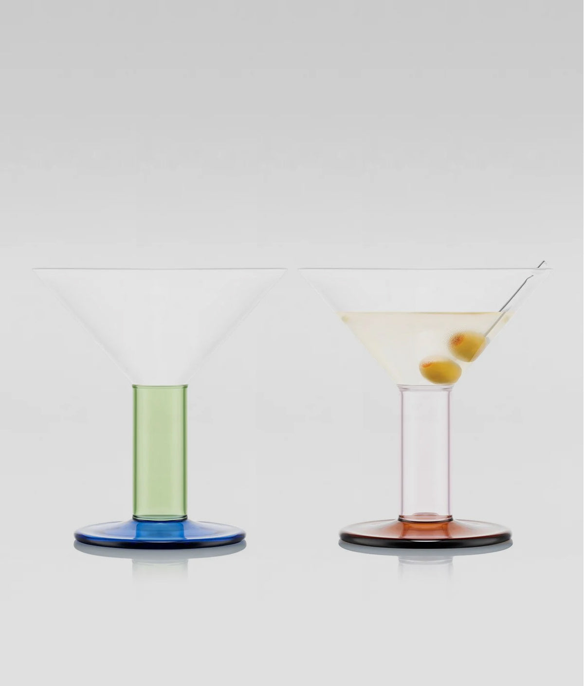 two colourful bodum x moma martini glasses on a grey background, product image