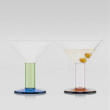two colourful bodum x moma martini glasses on a grey background, product image