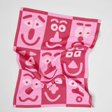 Making Faces Pink/Maroon Tea Towel