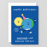 the earth is racing around the sun on a blue background on this birthday card