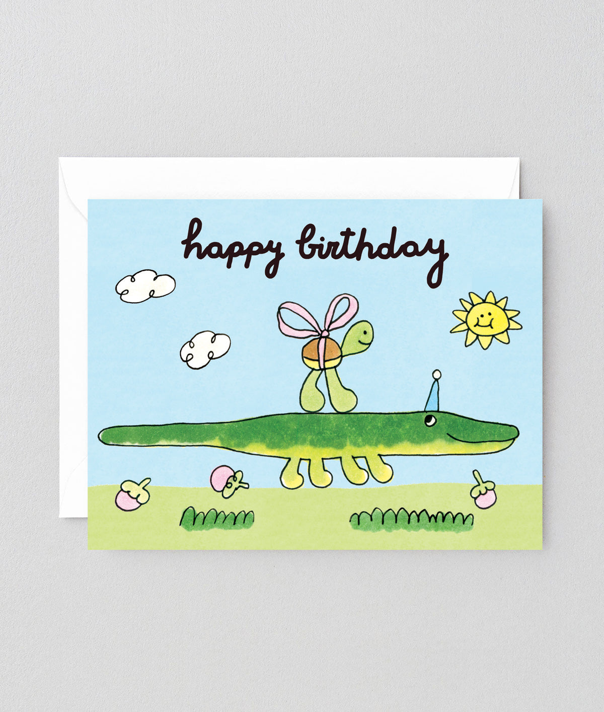 Birthday card with a green alligator and turtle illustration on a blue sky background.