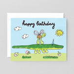 Birthday card with a green alligator and turtle illustration on a blue sky background.