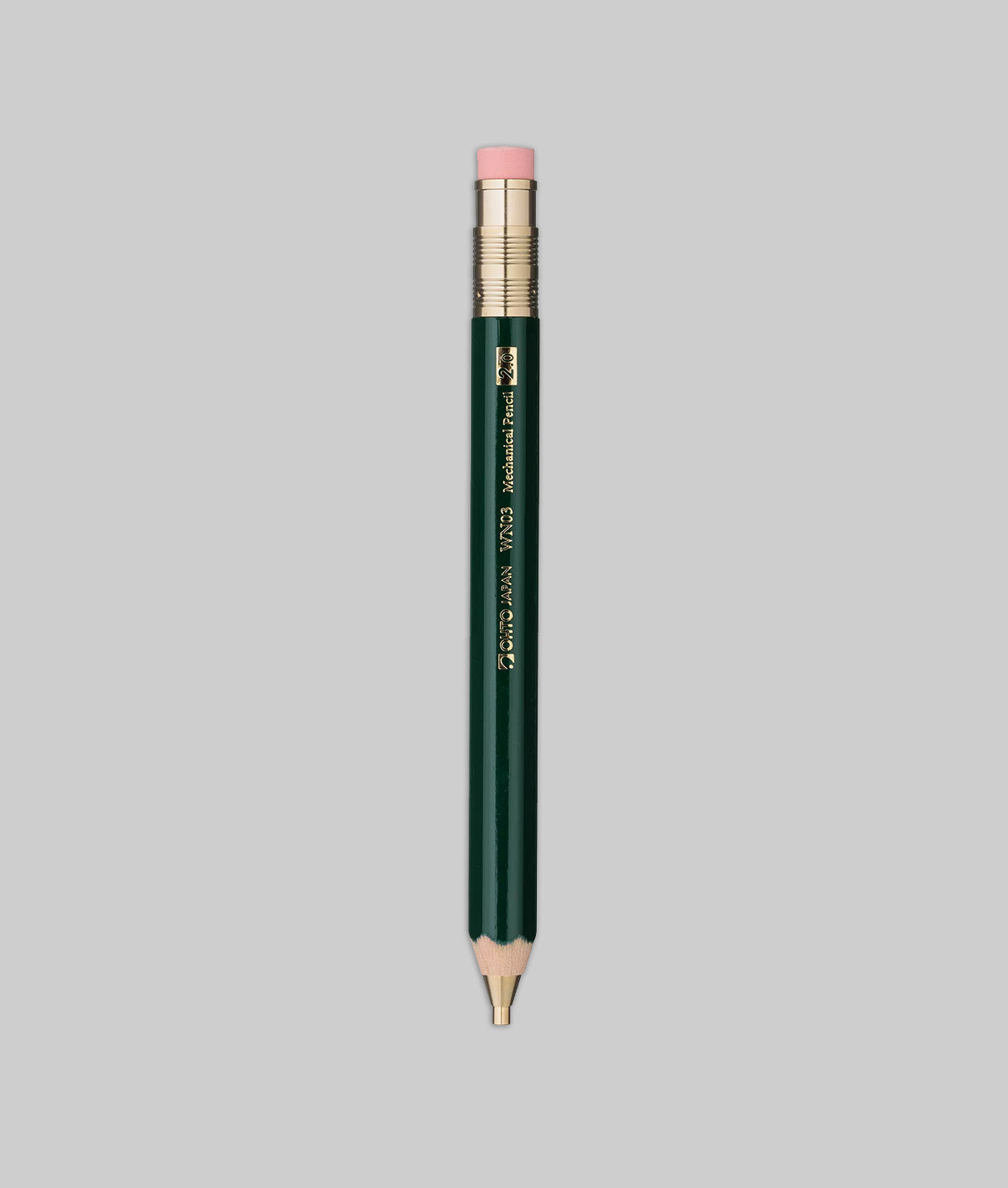 Green makeup pencil with pink cap on a gray background