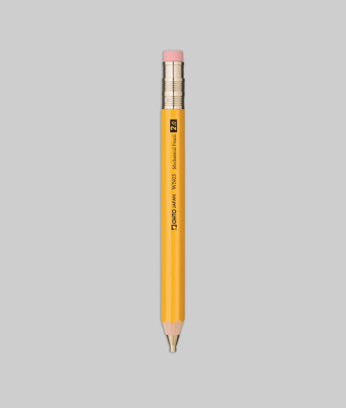 Yellow pencil with pink eraser on a gray background