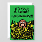 Birthday card showing a monkey in a pile of bananas saying it's your birthday...go bananas