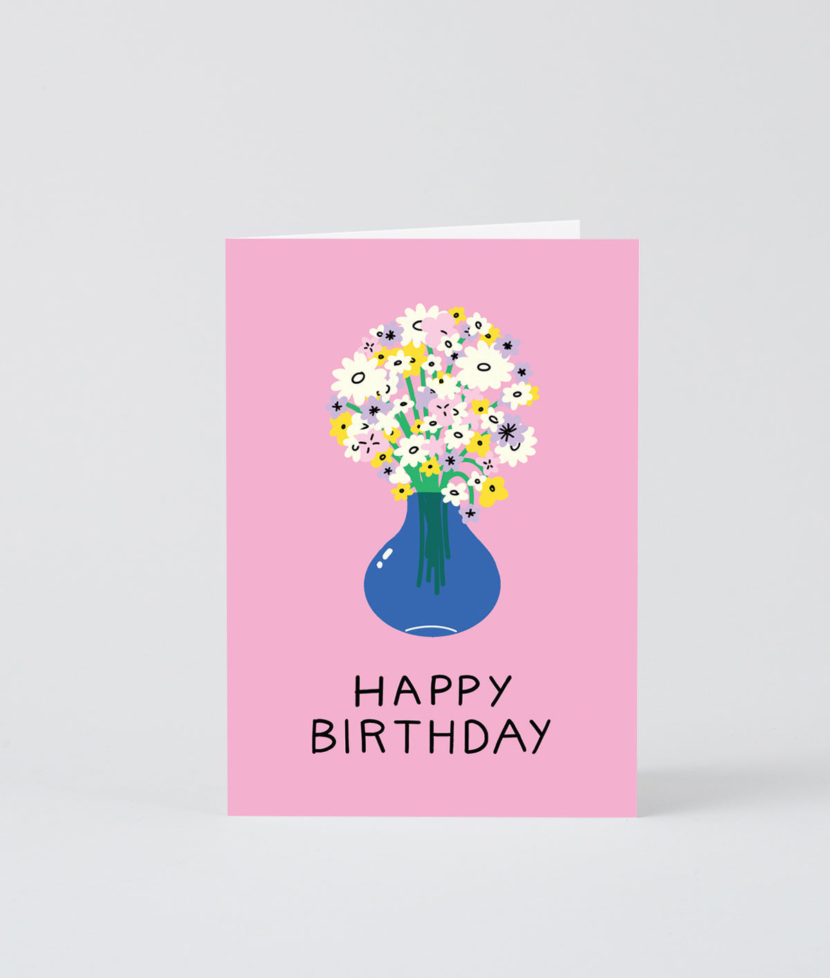 this pink birthday card shows a bunch of flowers in a blue vase and says Happy Birthday