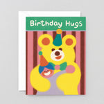 a big birthday bear hug on this stripy birthday card for kids. a big yellow bear hugs a person in a party hat and it says Birthday Hugs on a green background. 